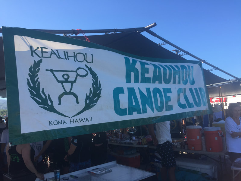Keauhou Canoe Club signage and tent station in Kona, Hawaii
